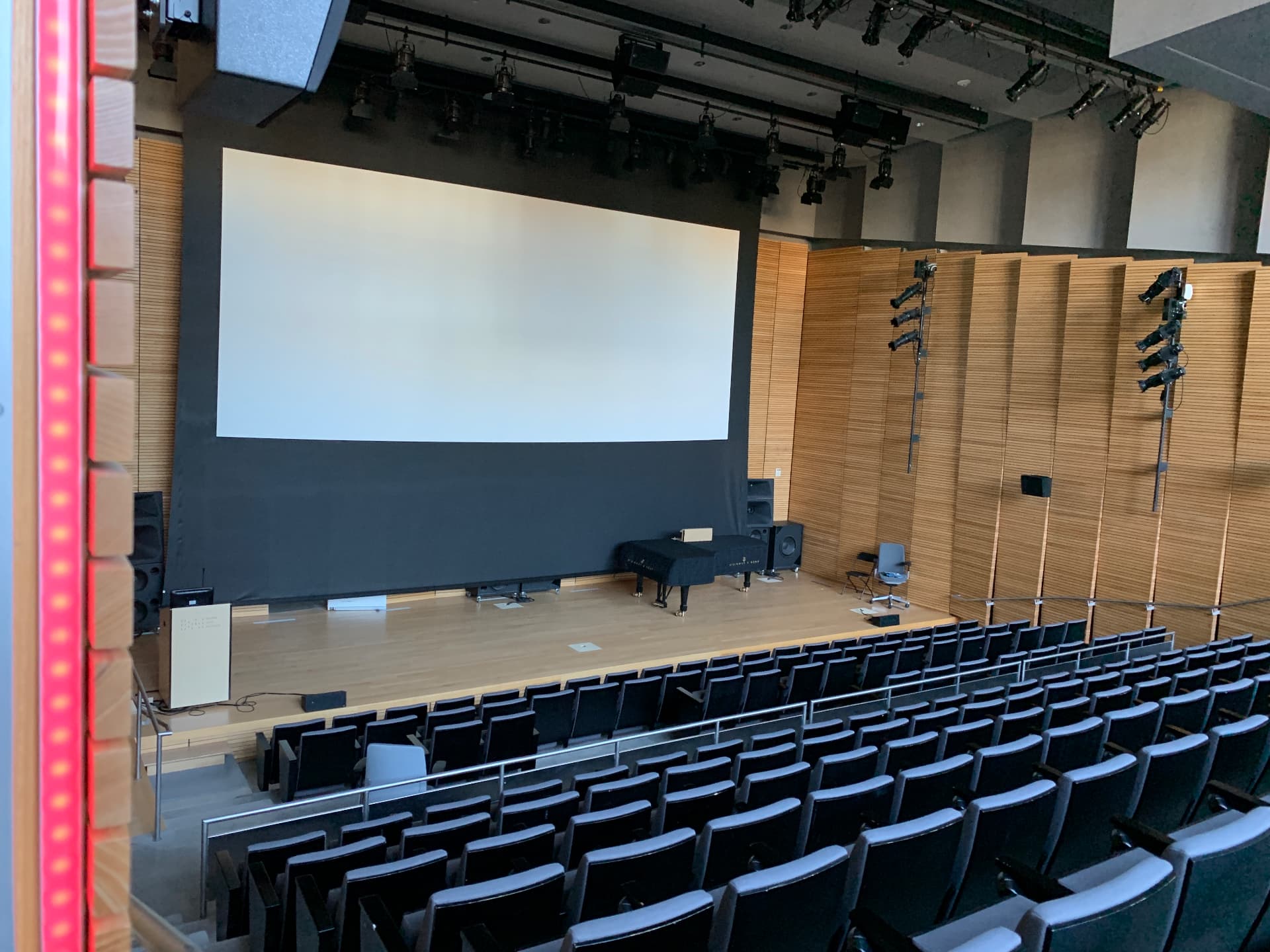 The Martinos Auditorium with cinema screen deployed and full screening playback chain.