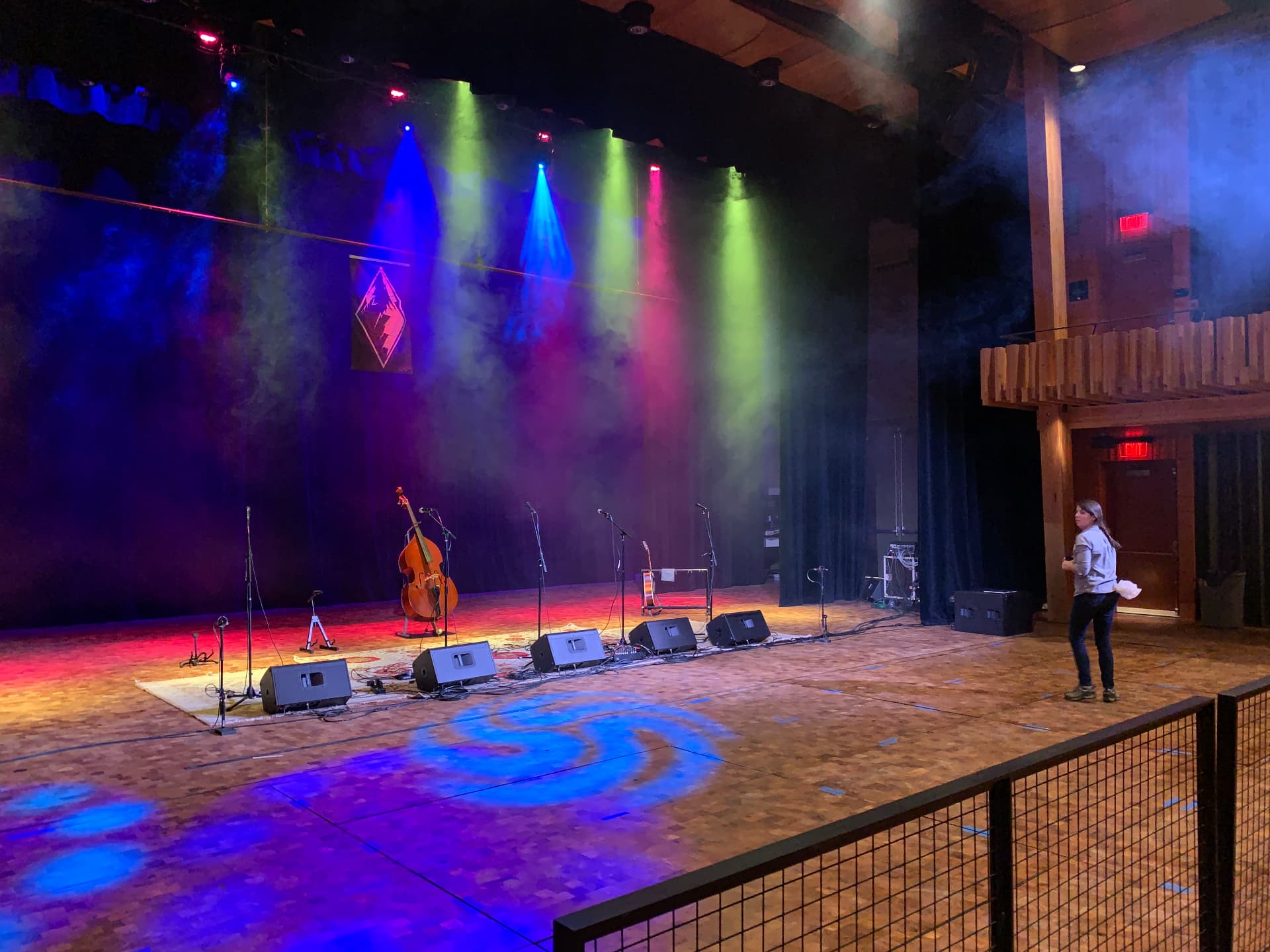 Stage set for a concert with monitor wedges and the house reinforcement system in service.